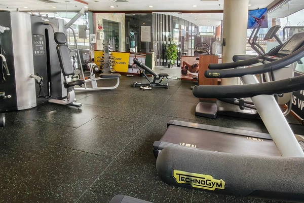 24-hour fitness center with elliptical machines and cross-trainers