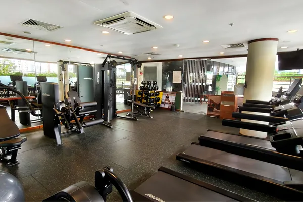 24-hour fitness center with elliptical machines and cross-trainers